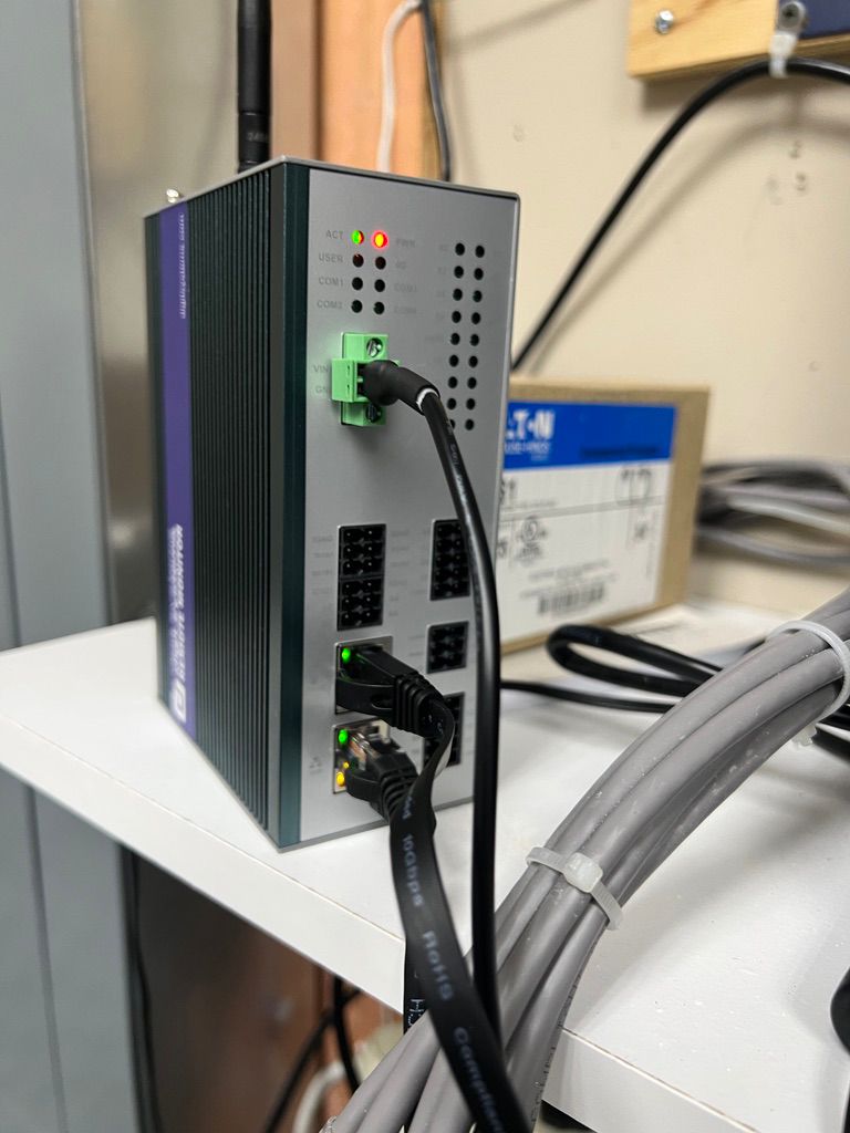 Installed MRI remote monitoring base unit with power and communication connections