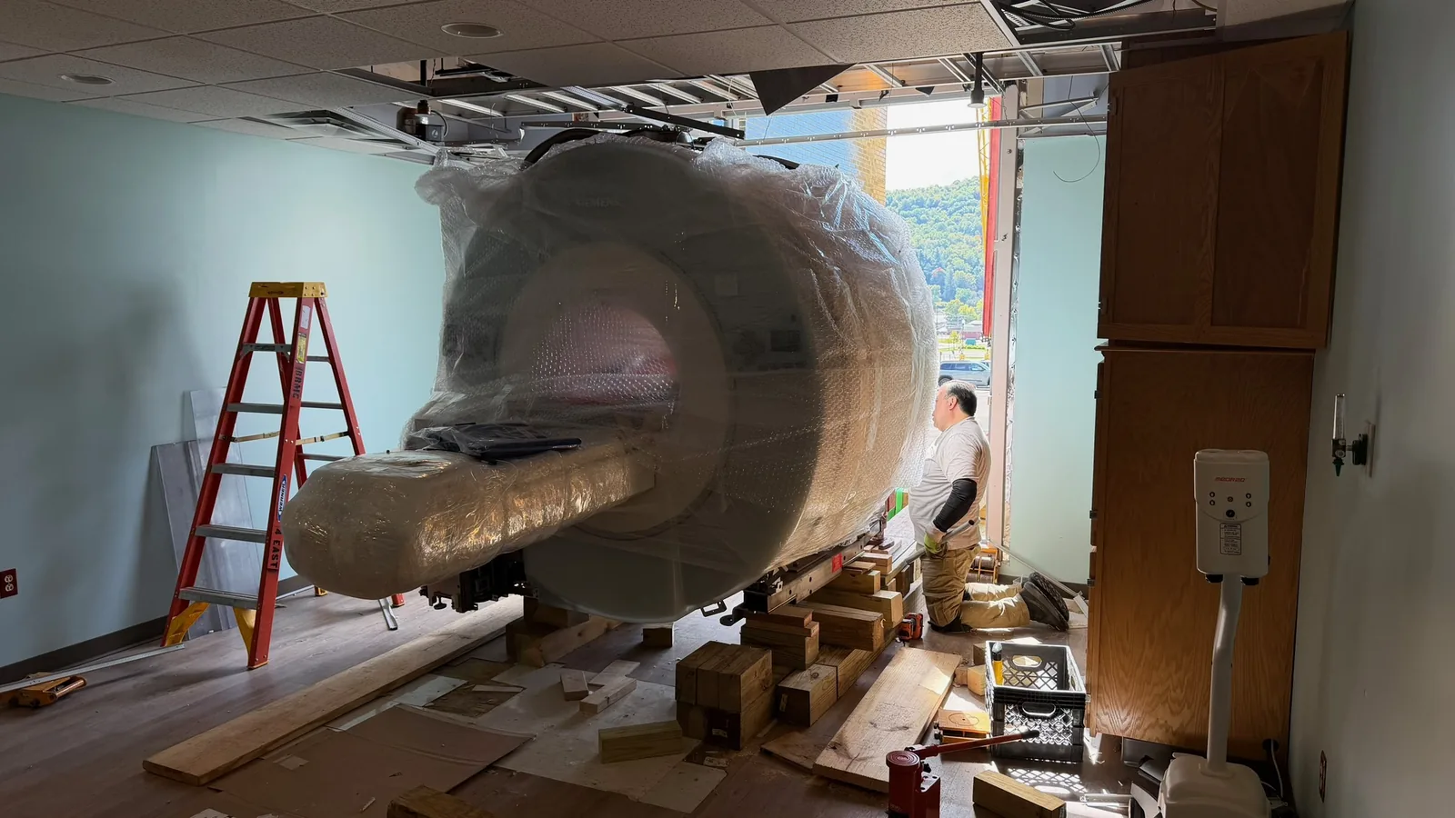 Wrapped Siemens MAGNETOM Espree MRI prepared for removal during deinstallation in Bradford, Pennsylvania.