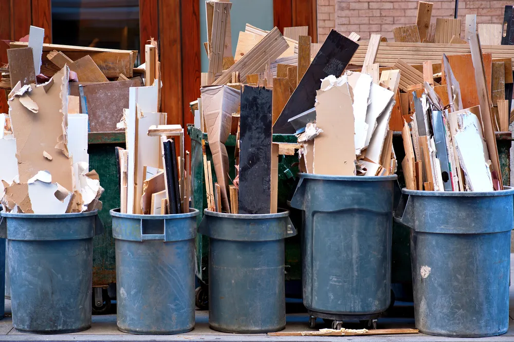 Various garbage cans containing diverse wood types, highlighting their unique appearances and characteristics.
