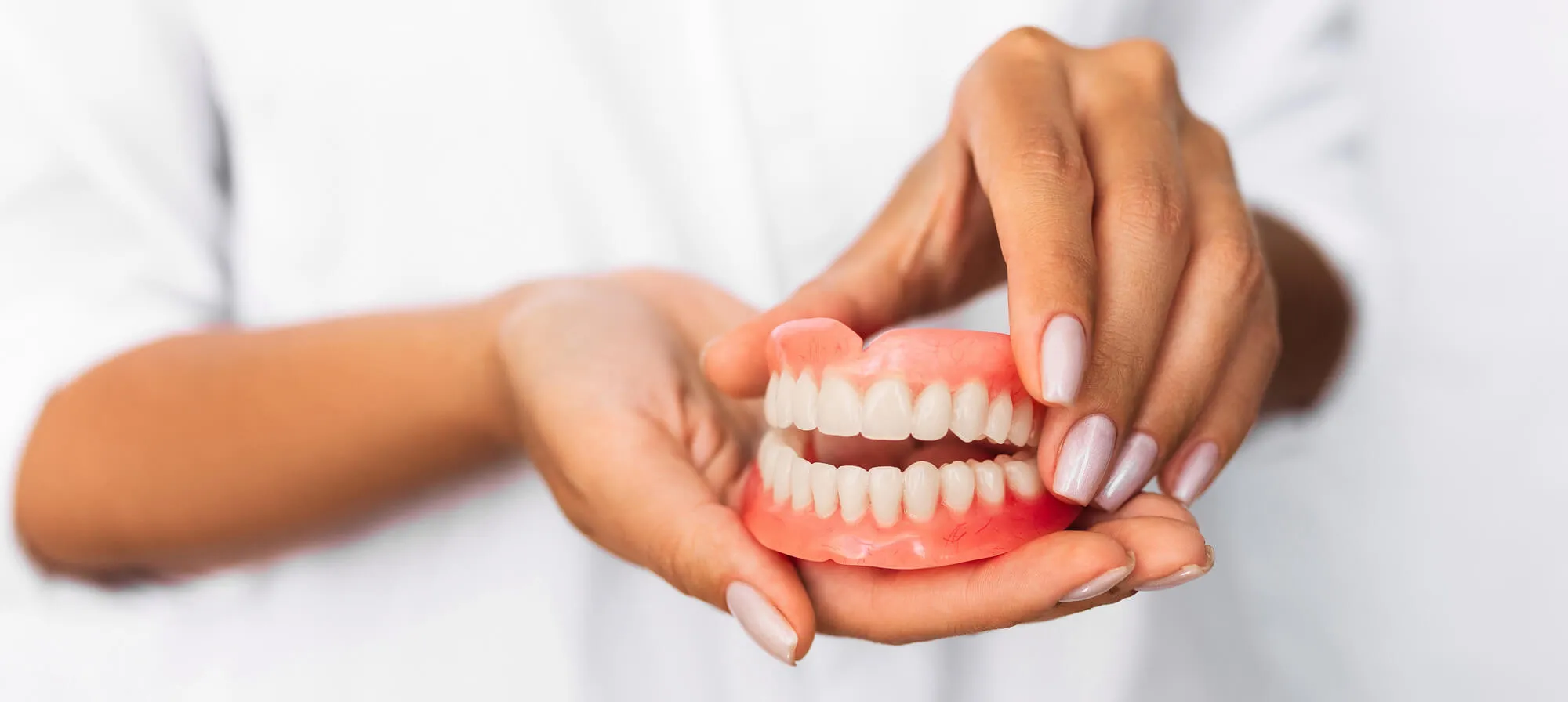 dentist holding dentures panama city fl