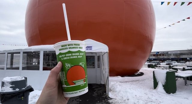 Orange Julep drink in front of the restaurant, also known as the largest orange sphere in the world, in Montreal. (Everything Lifestyle/Alessia Proietti)