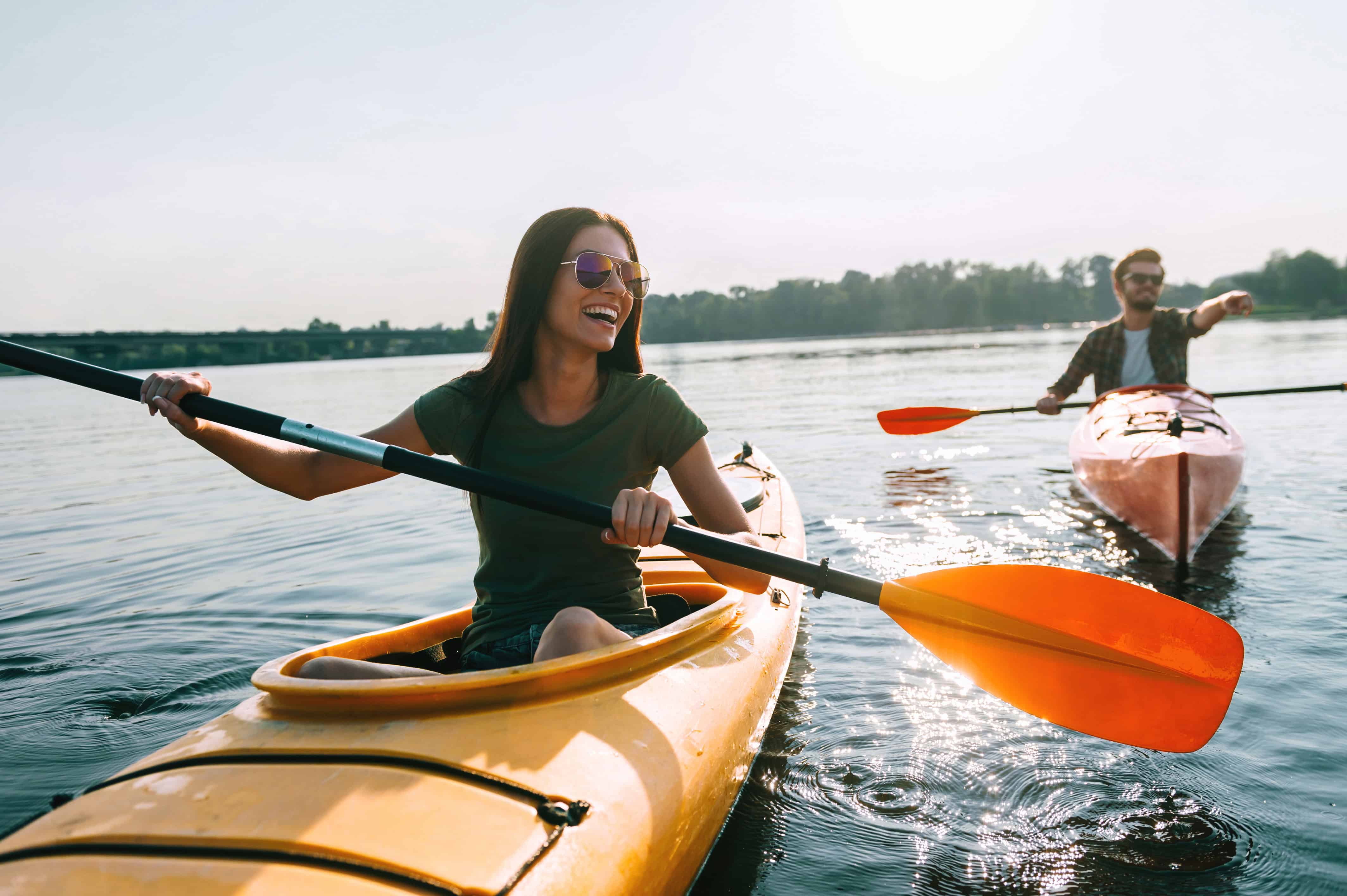 man and woman kayaking 
