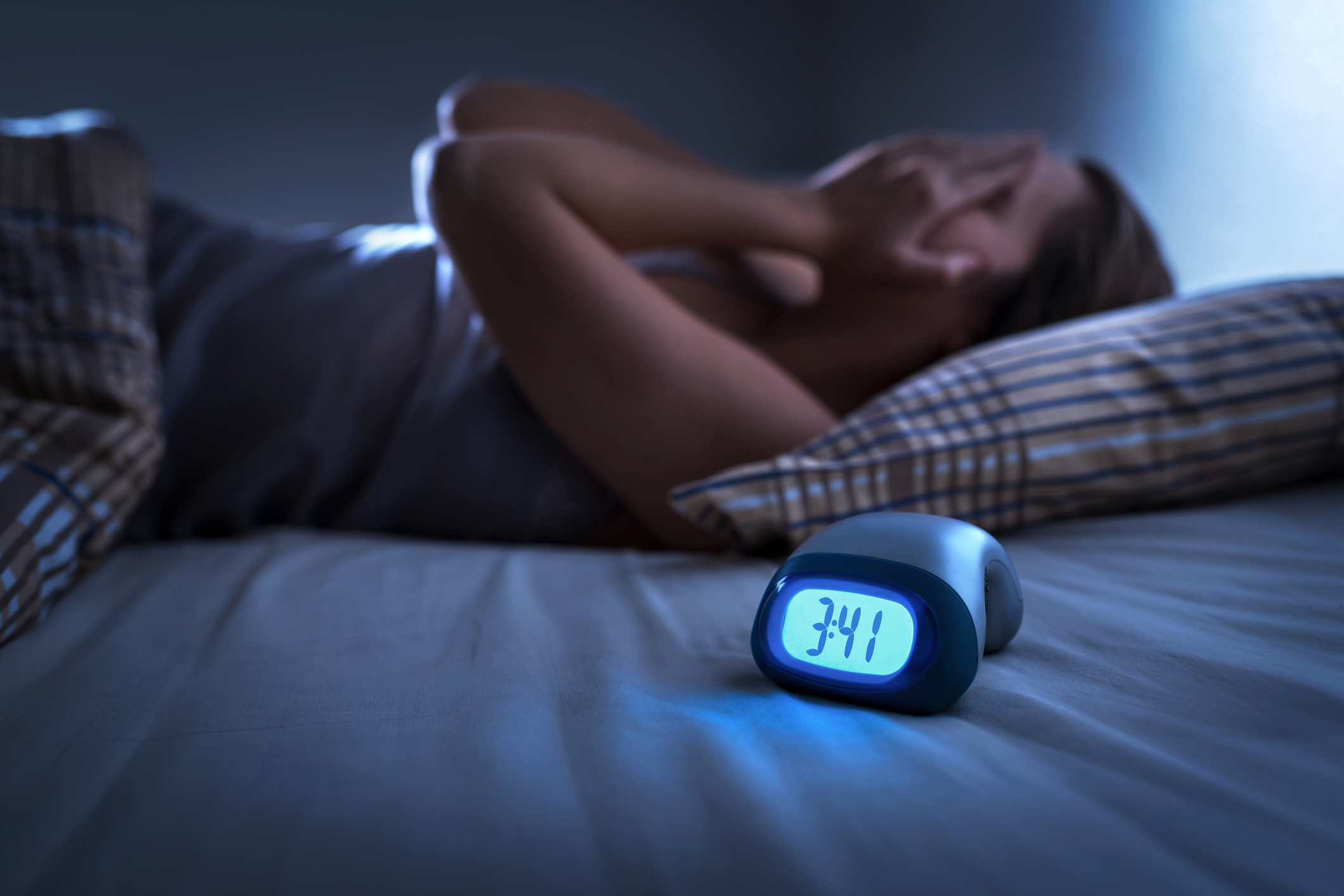 woman in bed can't sleep 