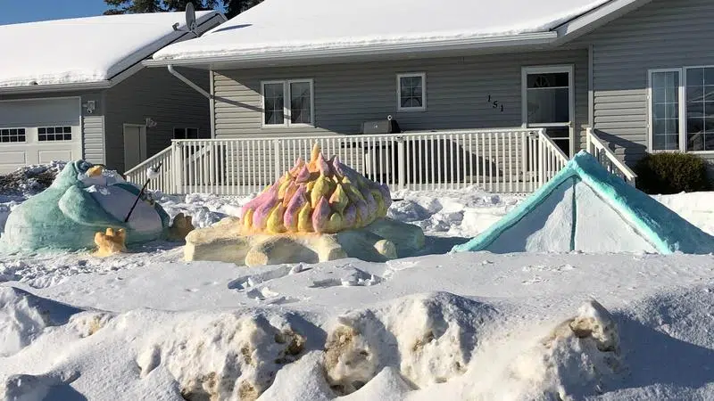 Snow sculptures in a front yard 