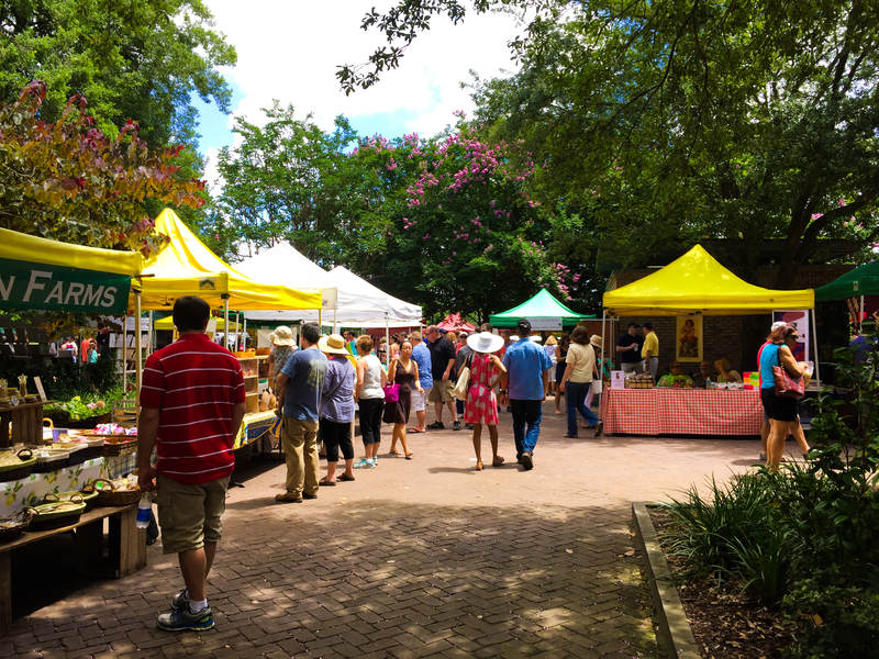 People shopping at a farmers market 