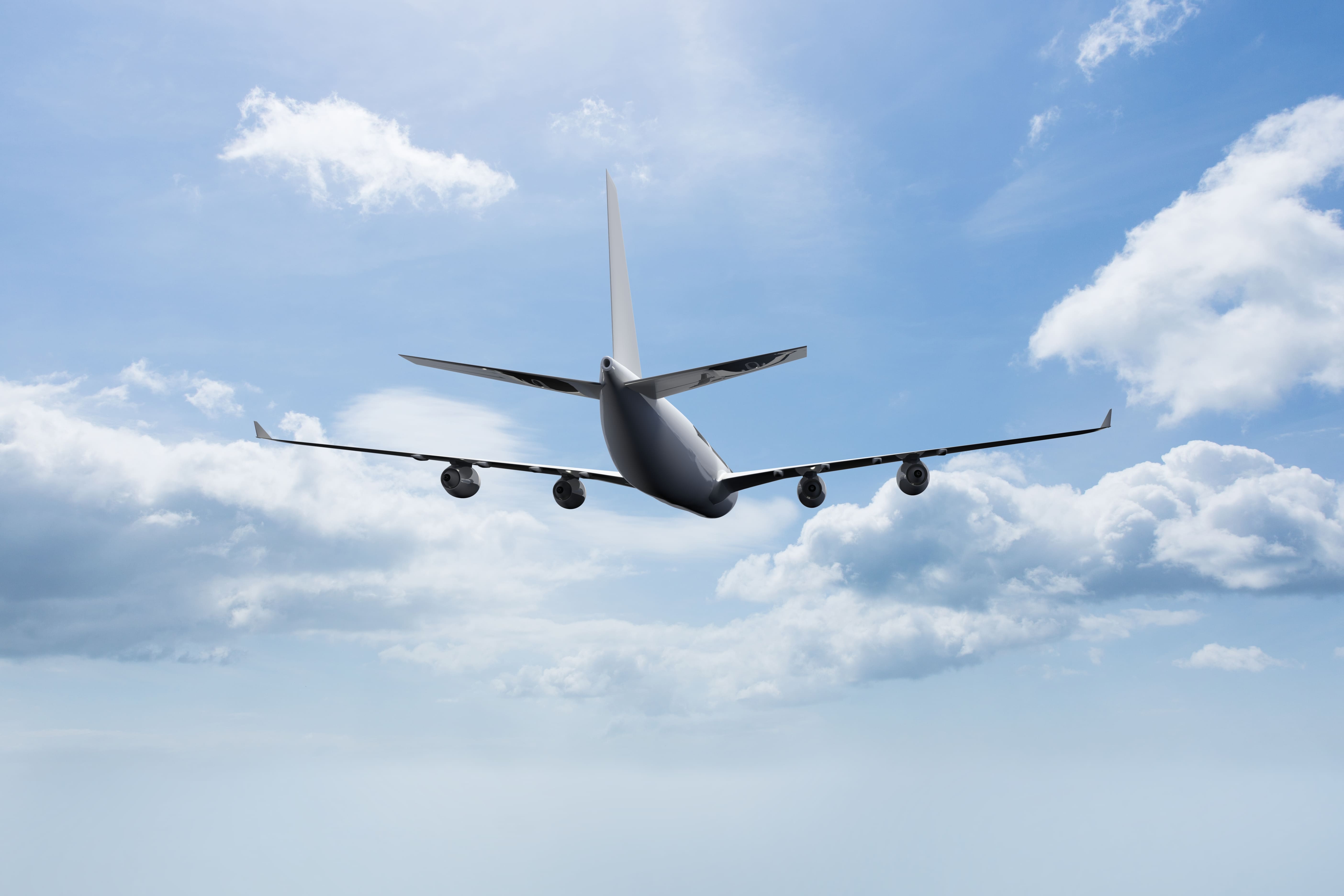 Plane flying with clouds