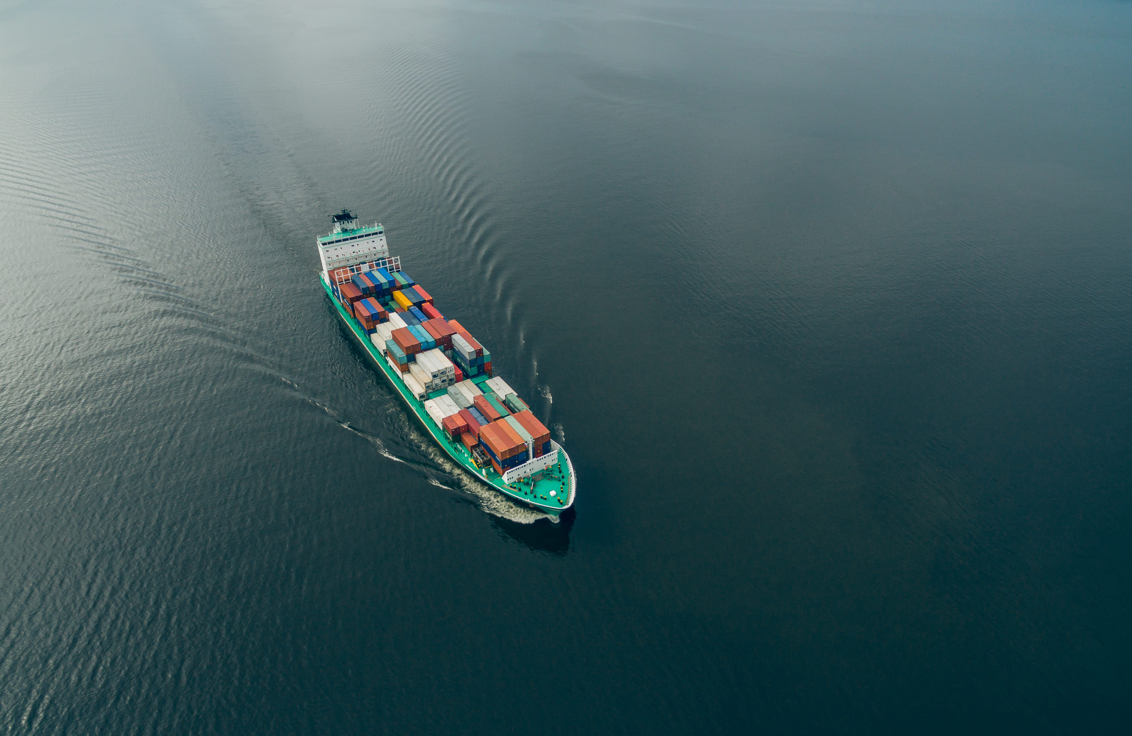 Freight ship sailing on top of the ocean.