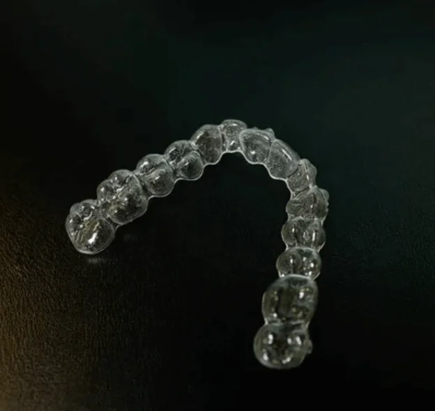 Transparent aligner on black surface clear aligners near you