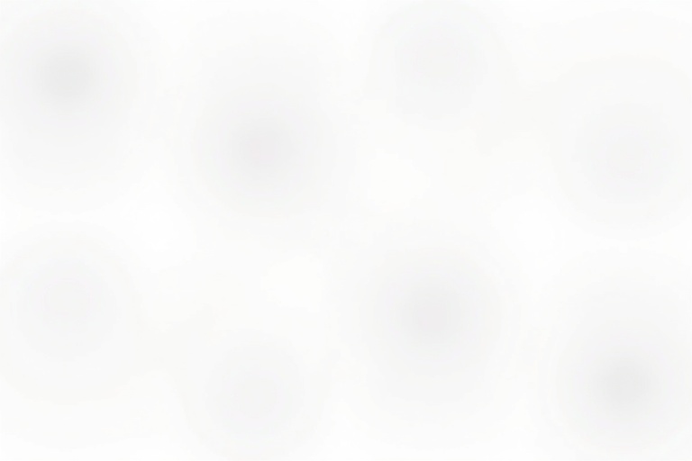 White surface with several faint, blurred circular shadows evenly spaced.