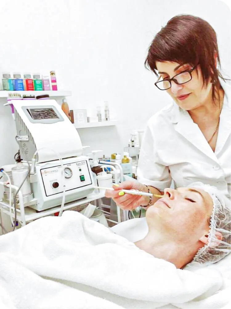 image of salon owner Gohar Arutunyan performing a facial treatment on a customer