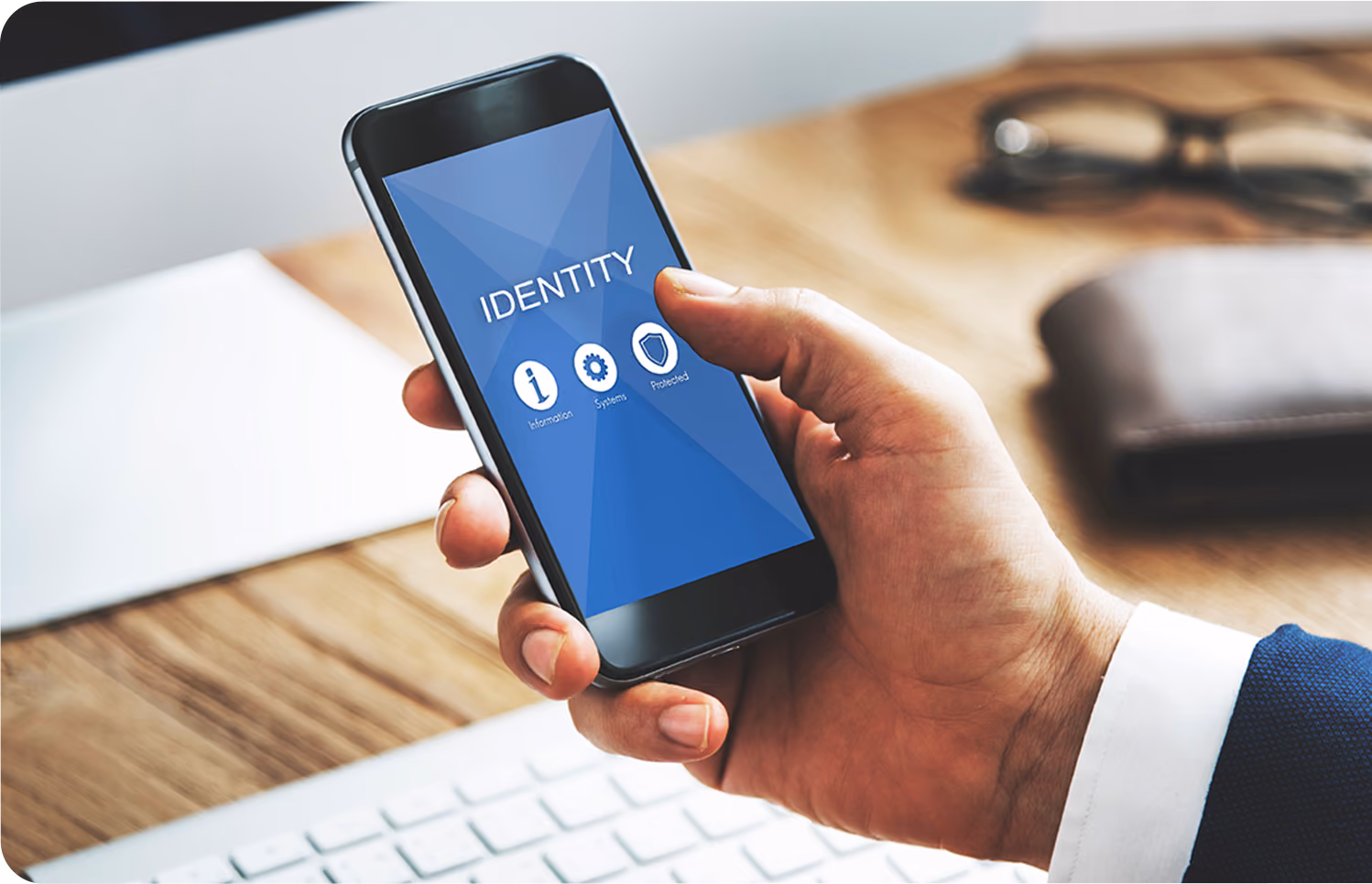 a smartphone displaying an identity protection app with icons for information, systems, and protected.