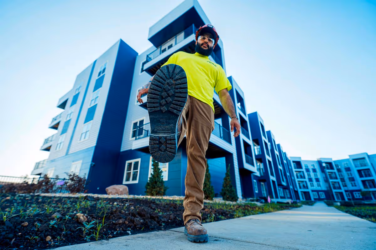 QBC worker with boot up ready to stomp on camera