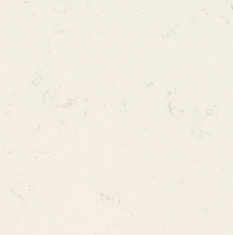 Closeup of One Quartz Carrara Pisa, creamy white quartz with soft veining, available in QBC countertop packages