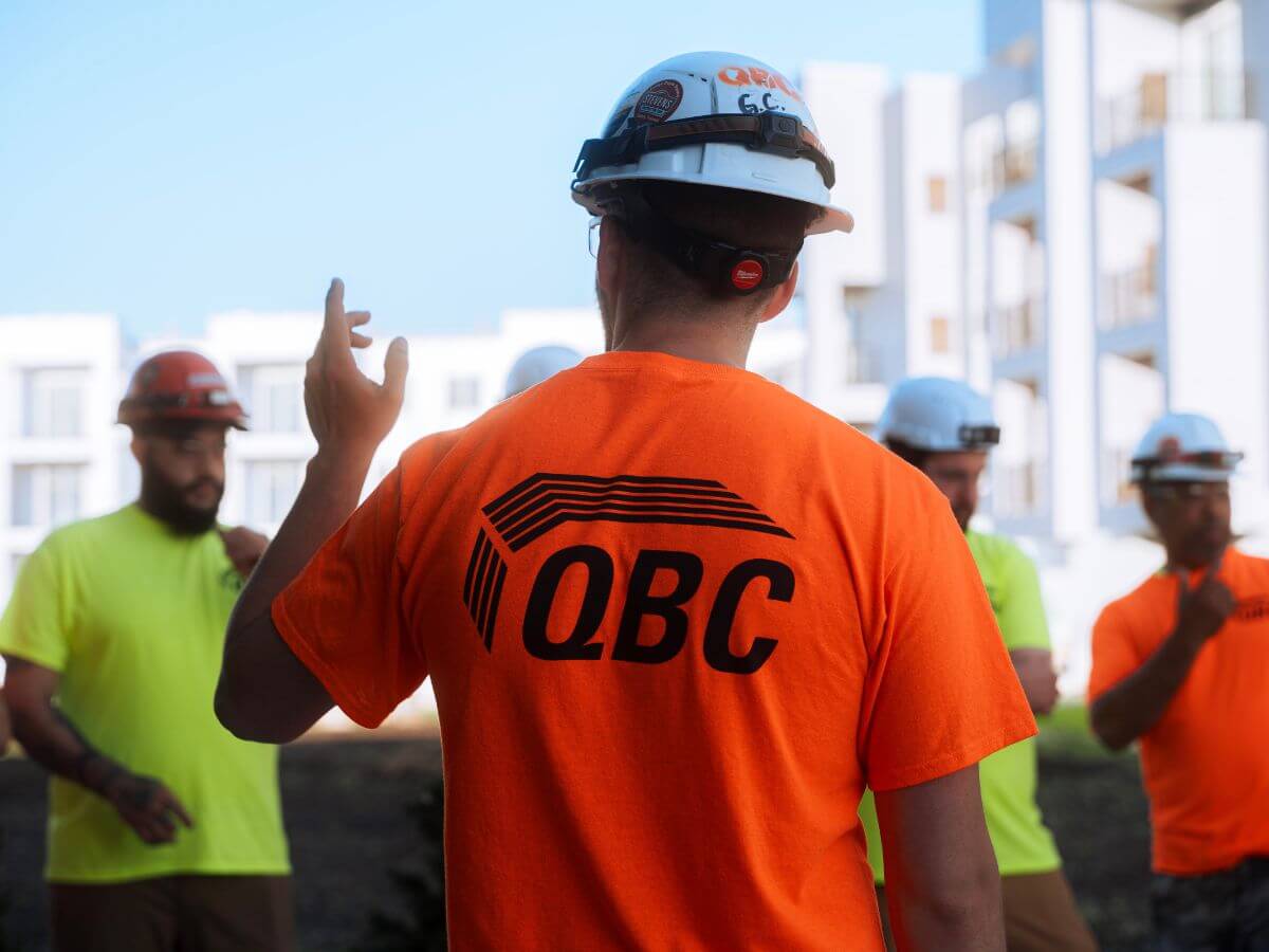 A QBC foreman holds and accountability meeting on a job site in Madison, Wisconsin.