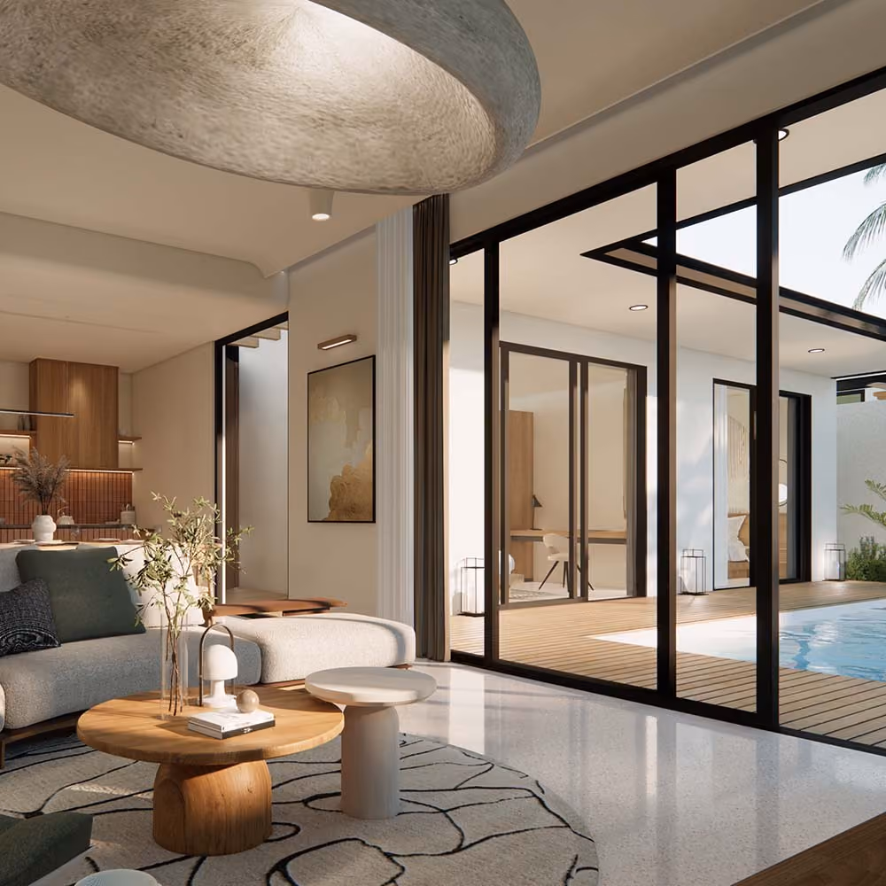 View through a spacious living room and through large floor to ceiling doors on to the outdoor pool area