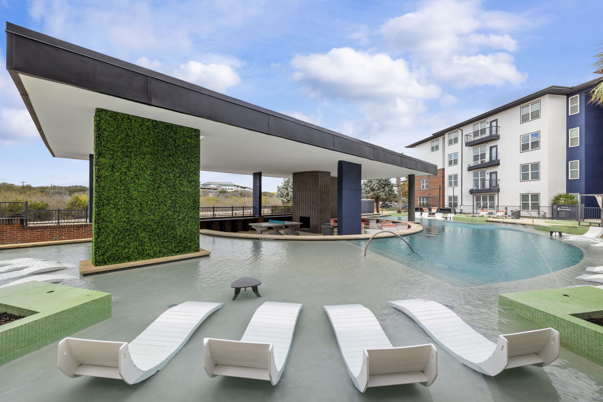 Lounge chairs near swimming pool
