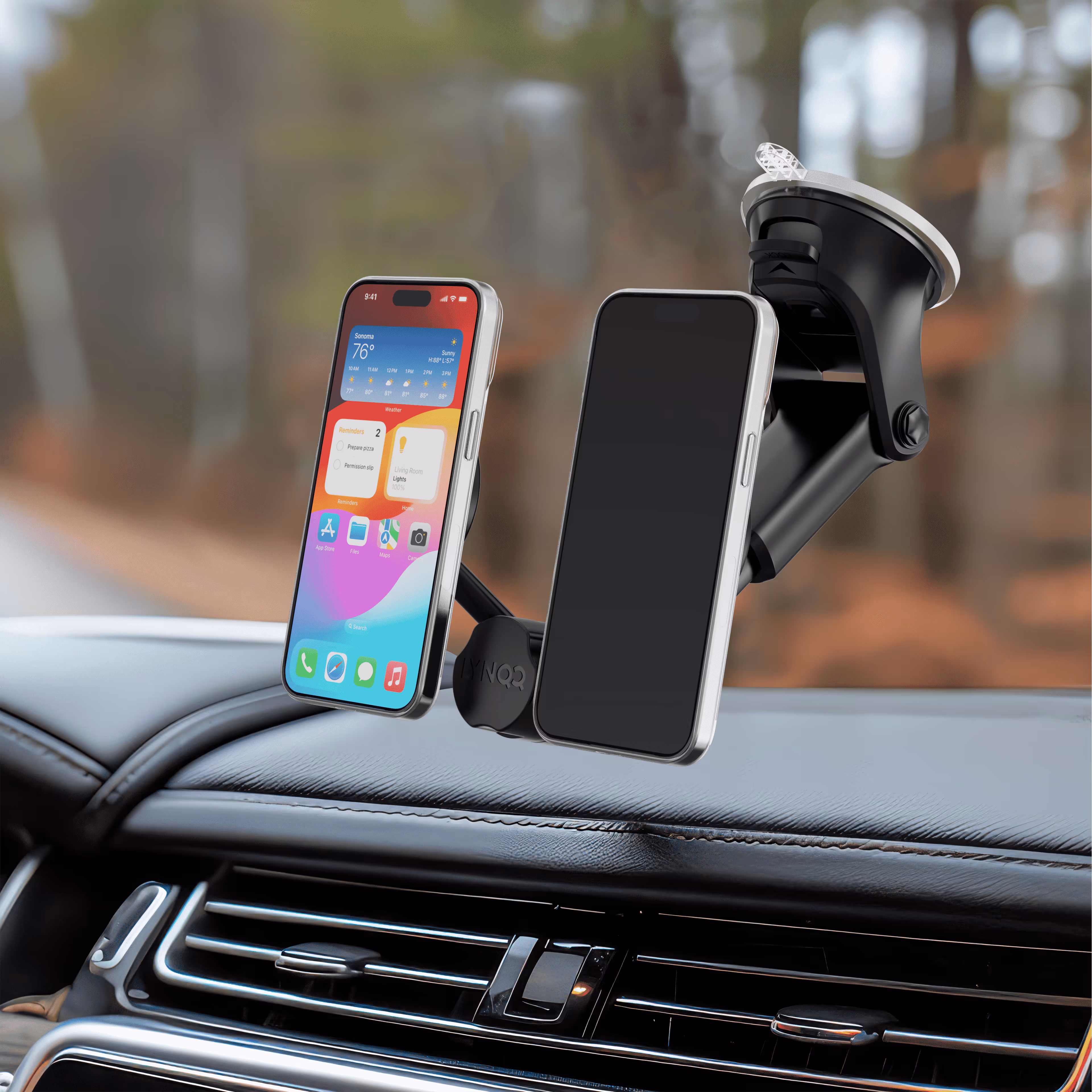 Smartphone mounted on car dashboard using a suction cup phone holder