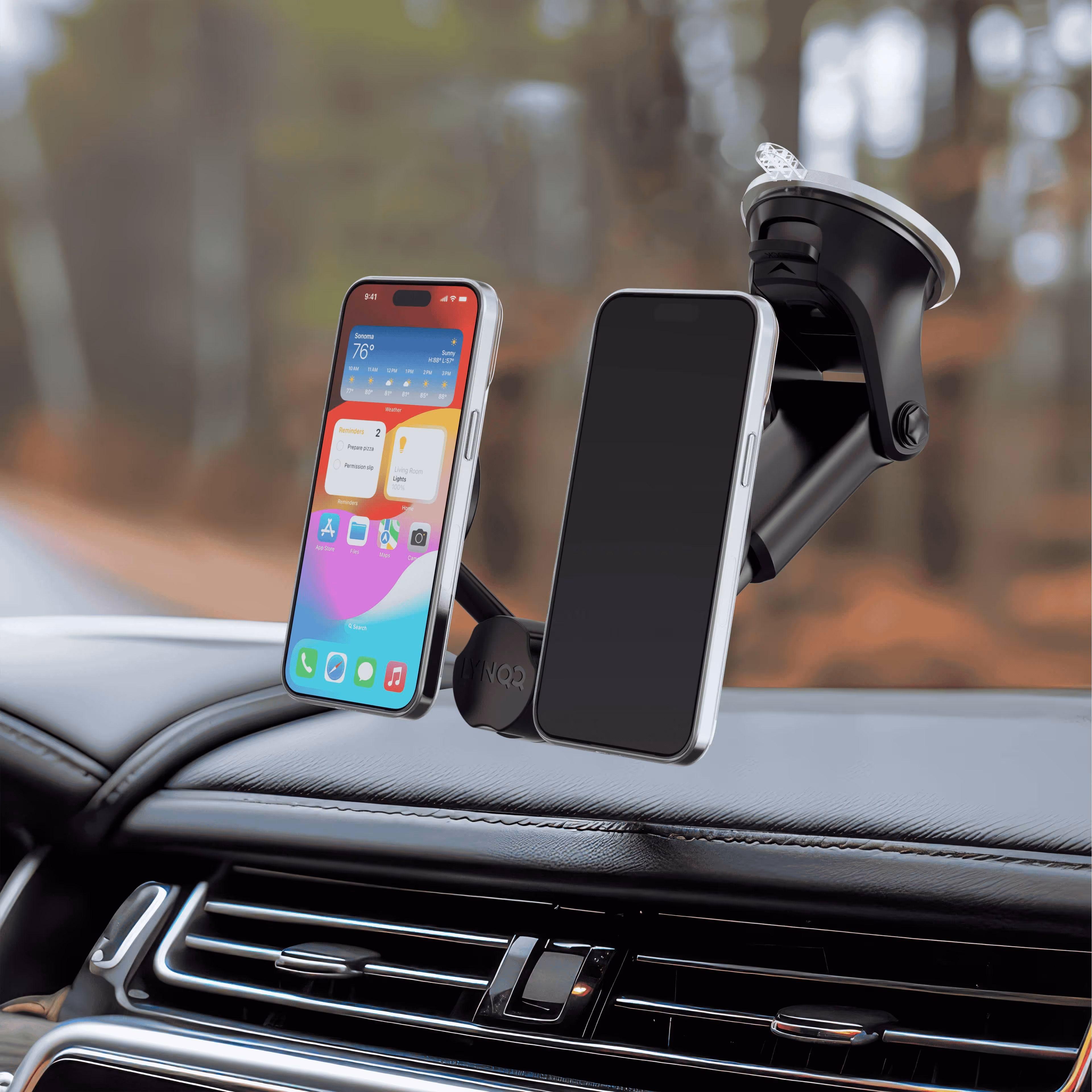 Smartphone mounted on car dashboard using suction cup phone holder