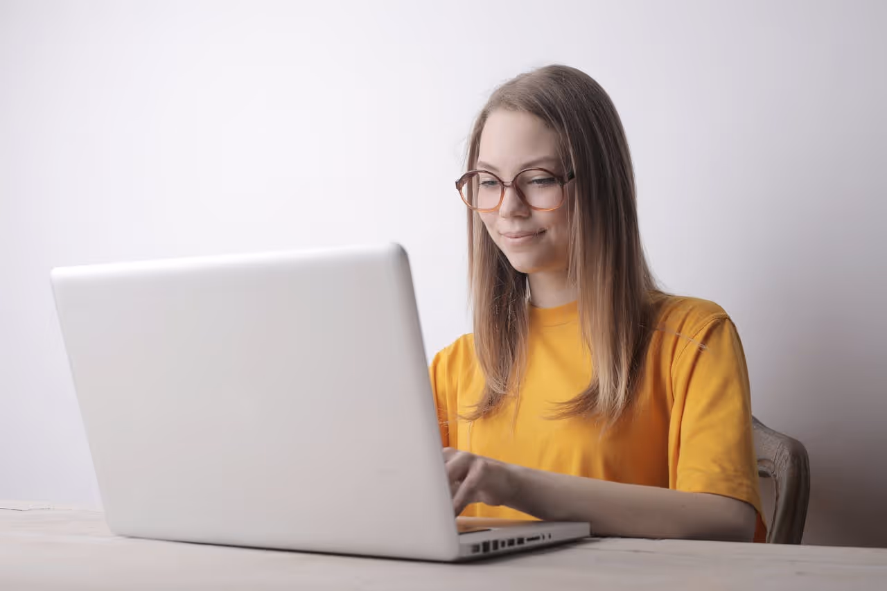 business woman smiling in front of whiteboard