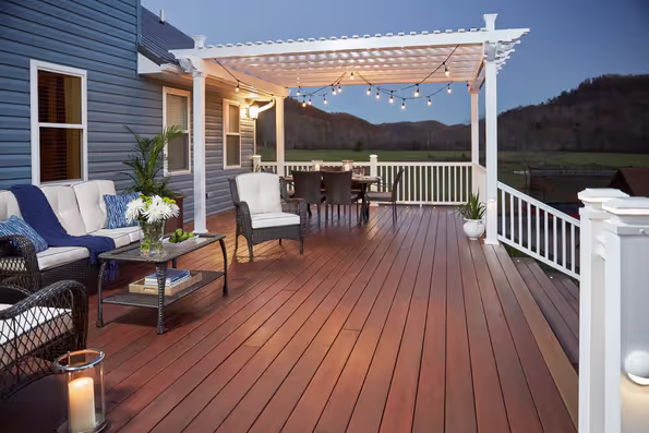 Alpine White Fiberon CountrySide Composite Rail installed on a new deck with a stylish vinyl pergola, showcasing Upgryd's custom outdoor living solutions.