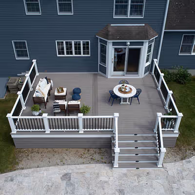 TimberTech Vintage Coastline decking with Classic Composite Series Premier Rail installed by Upgryd, showcasing a sophisticated and durable outdoor living space.