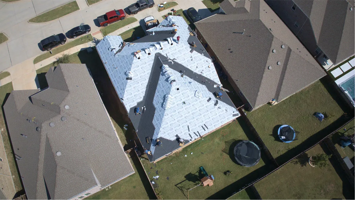 Legacy Roofing crew installing a residential roof