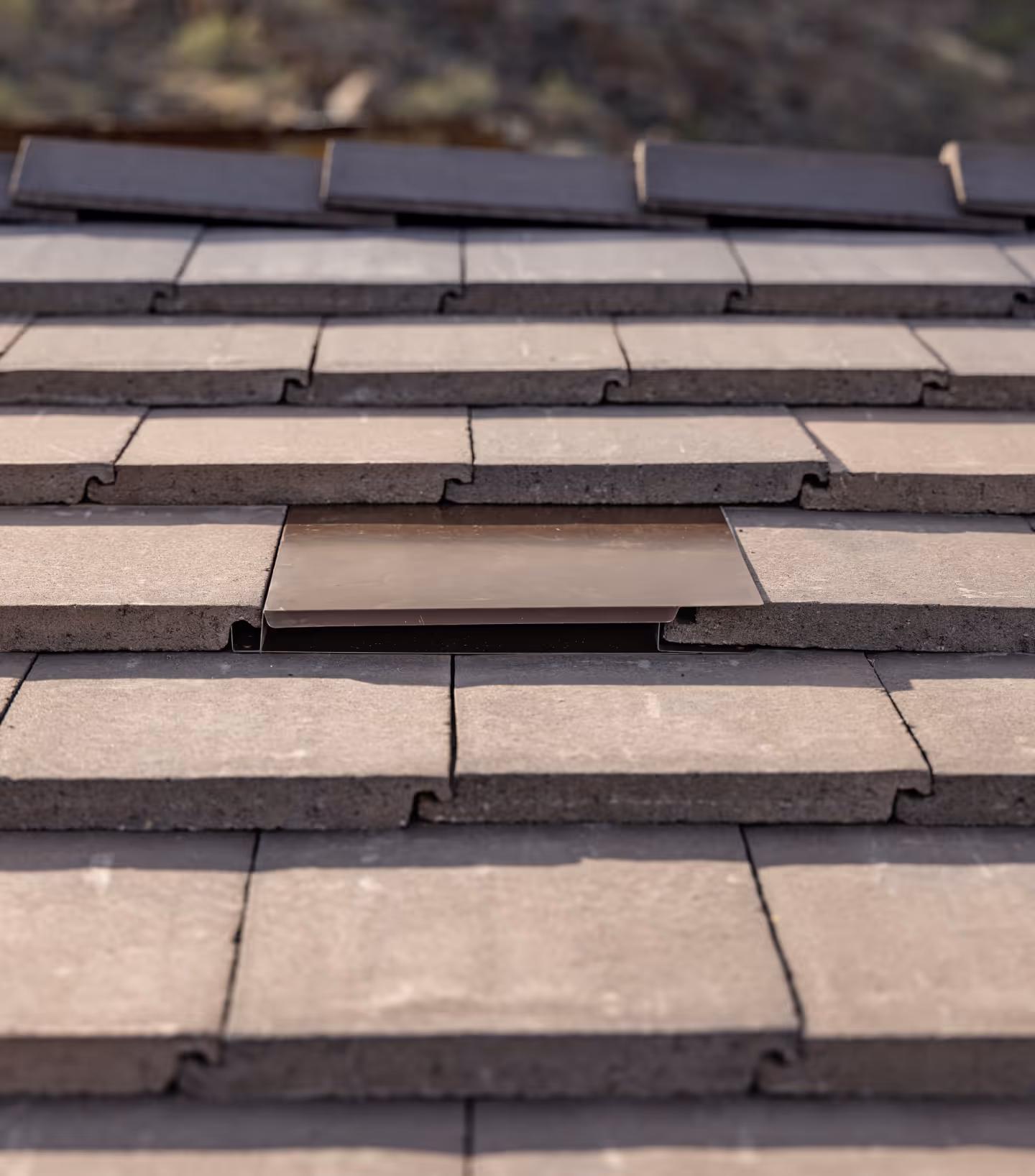 arial shot of a flat tile roof with Coronado Vents