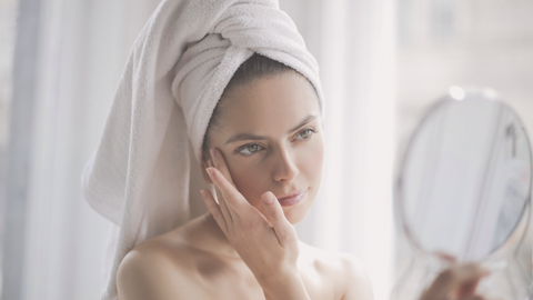 Woman looking in mirror