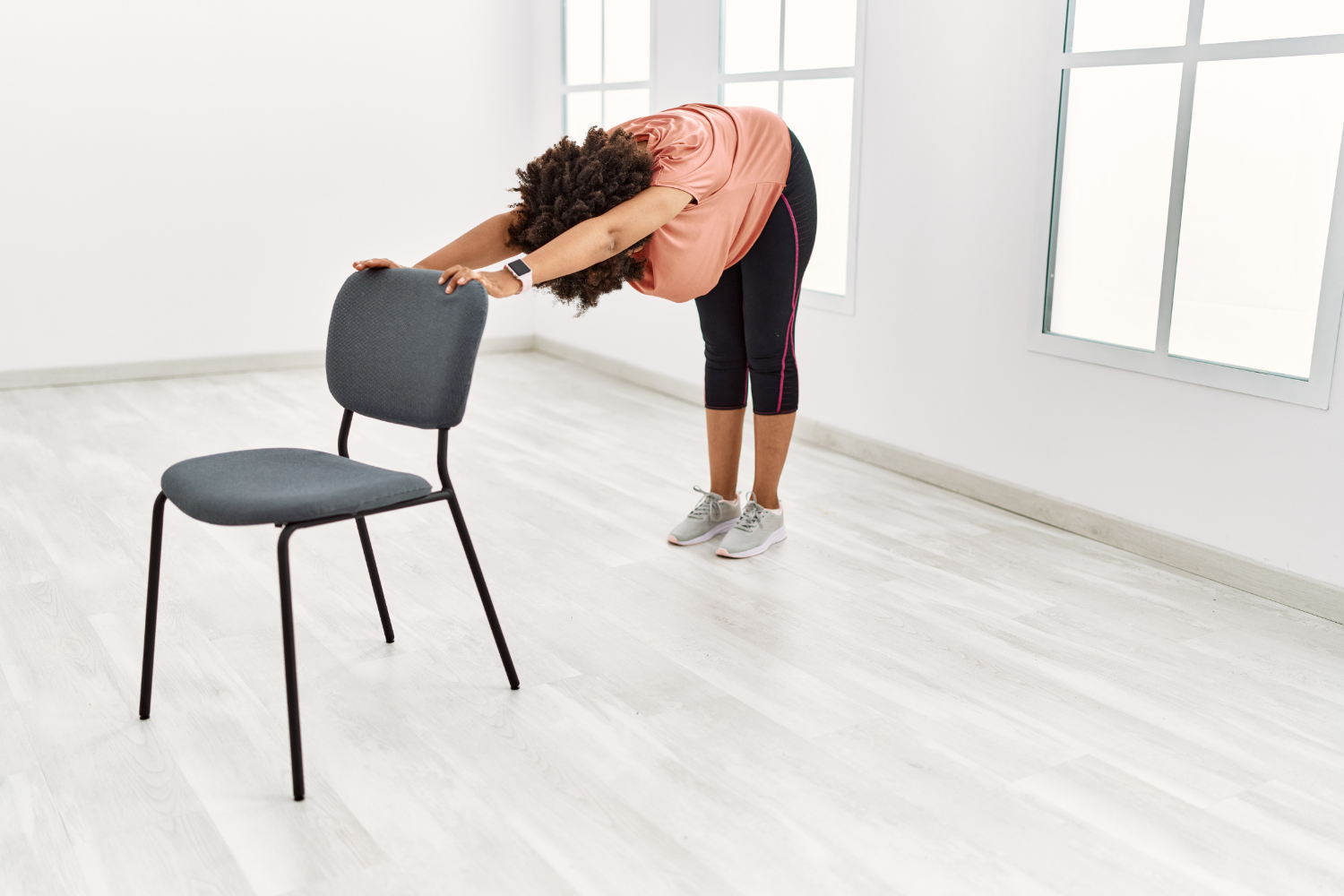 Seated chair yoga pose demonstrating alignment and mobility, relevant for the 