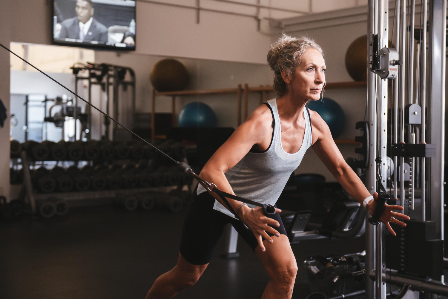 Strength training benefits for women over 40, emphasizing program structure for optimal strength gains at home.