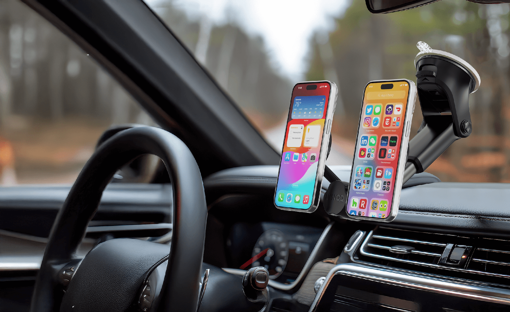 A person in a car using a dashboard phone mount for navigation and calls - personal and work phone A person in a car using a dashboard phone mount for navigation and calls - personal and work phone