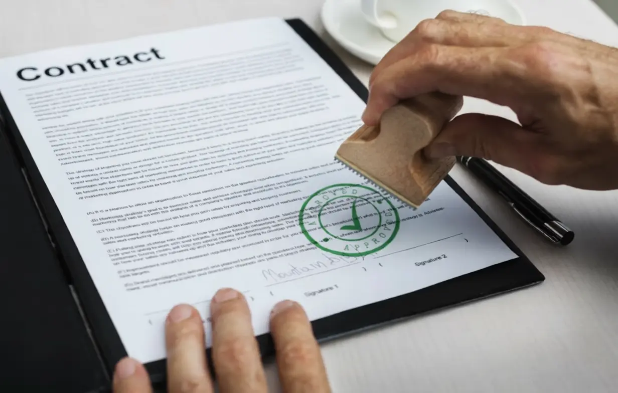 Image of a contract approved with a stamp