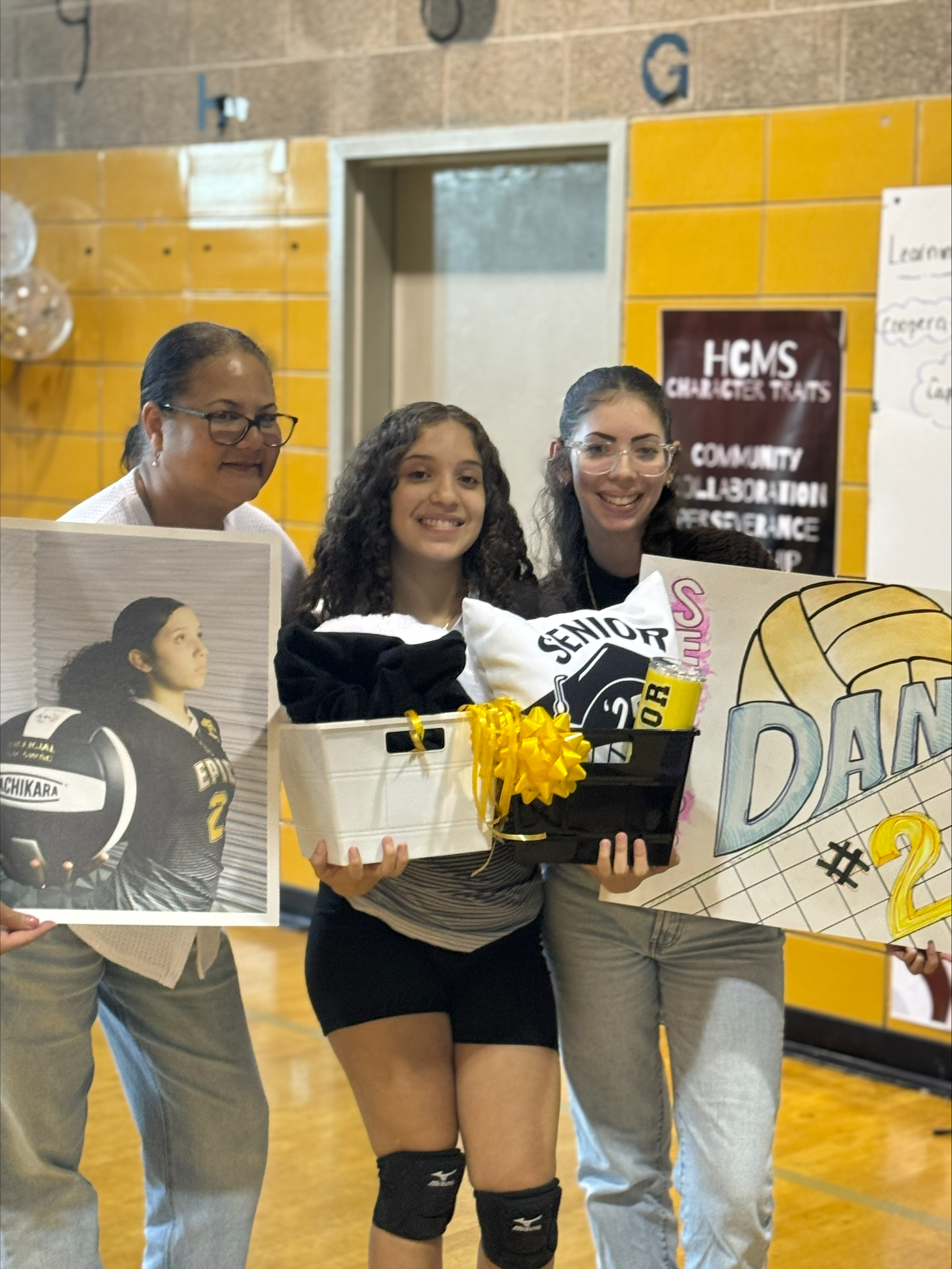 Volleyball player honored at senior night with family and gifts