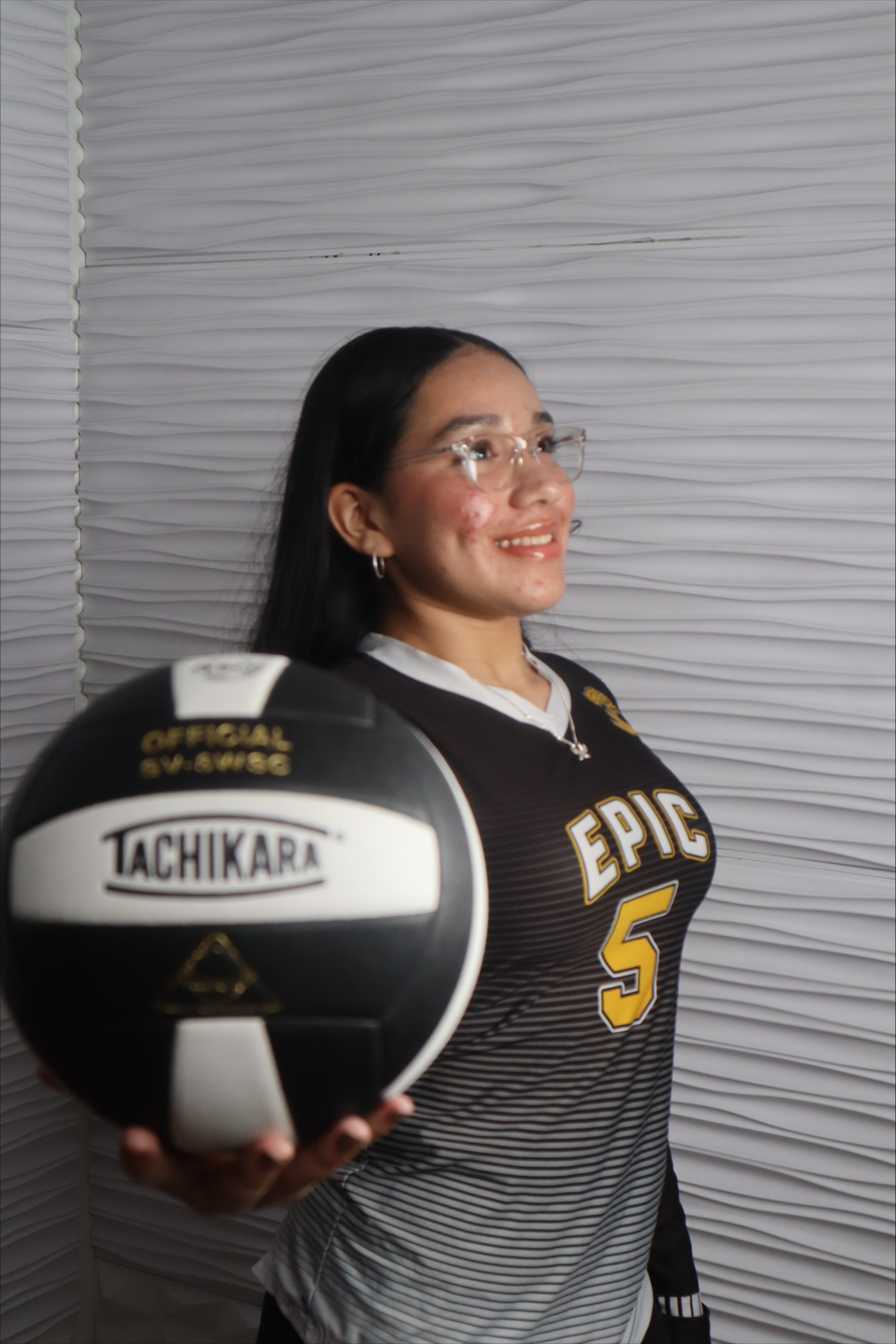 Epic High School South number 5 volleyball player holding a ball