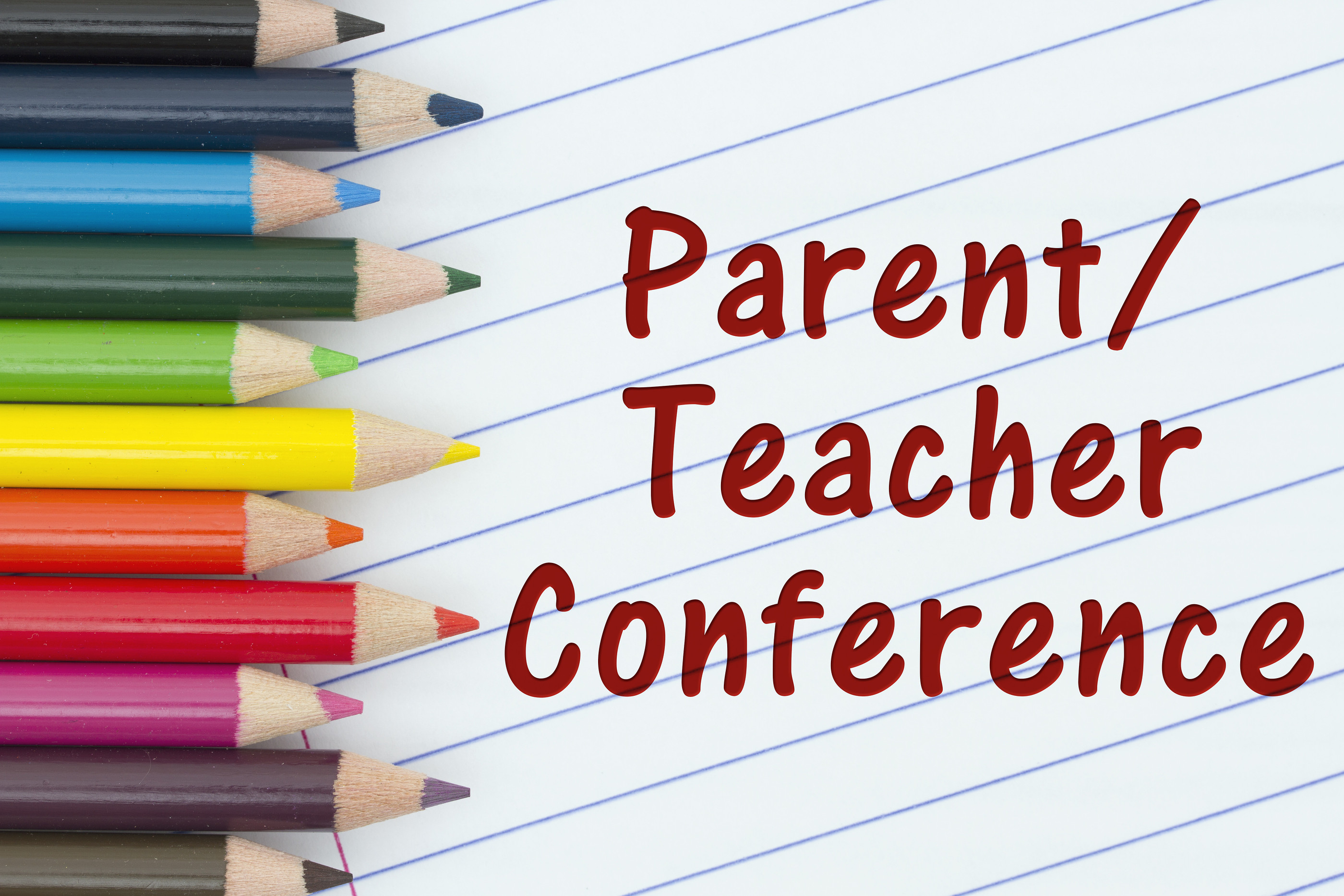 Colored pencils beside text reading Parent Teacher Conference