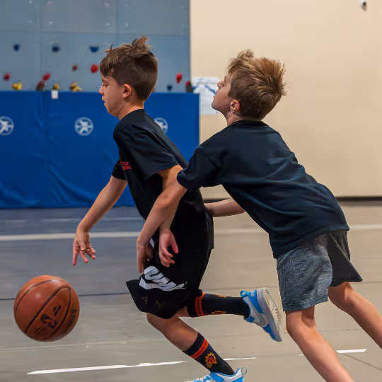 Kid running with basketball