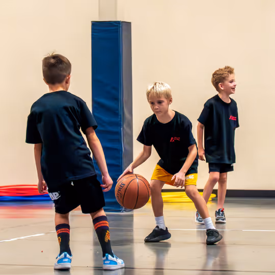 Kid dribbling a basketball