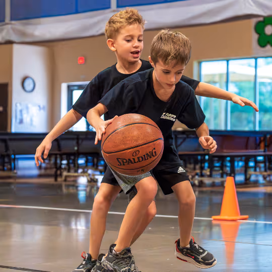 Kid defending basketball
