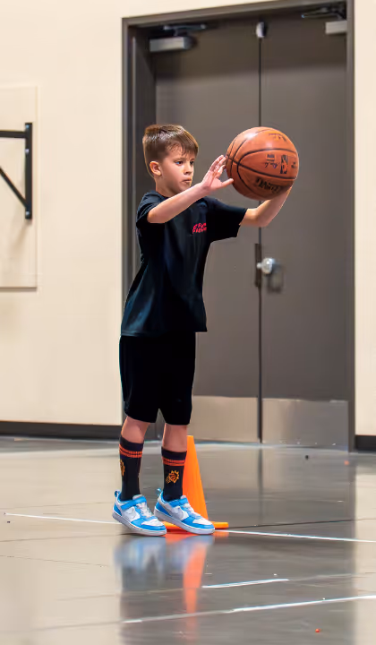 Kid holding basketball