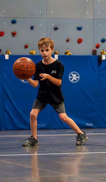 Kid holding basketball