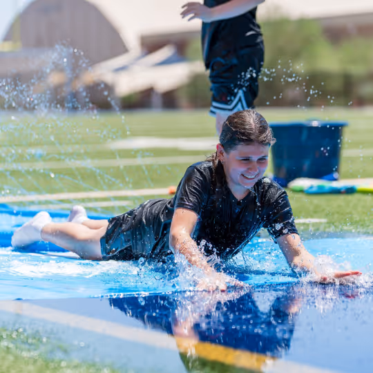Girl on slip and slide