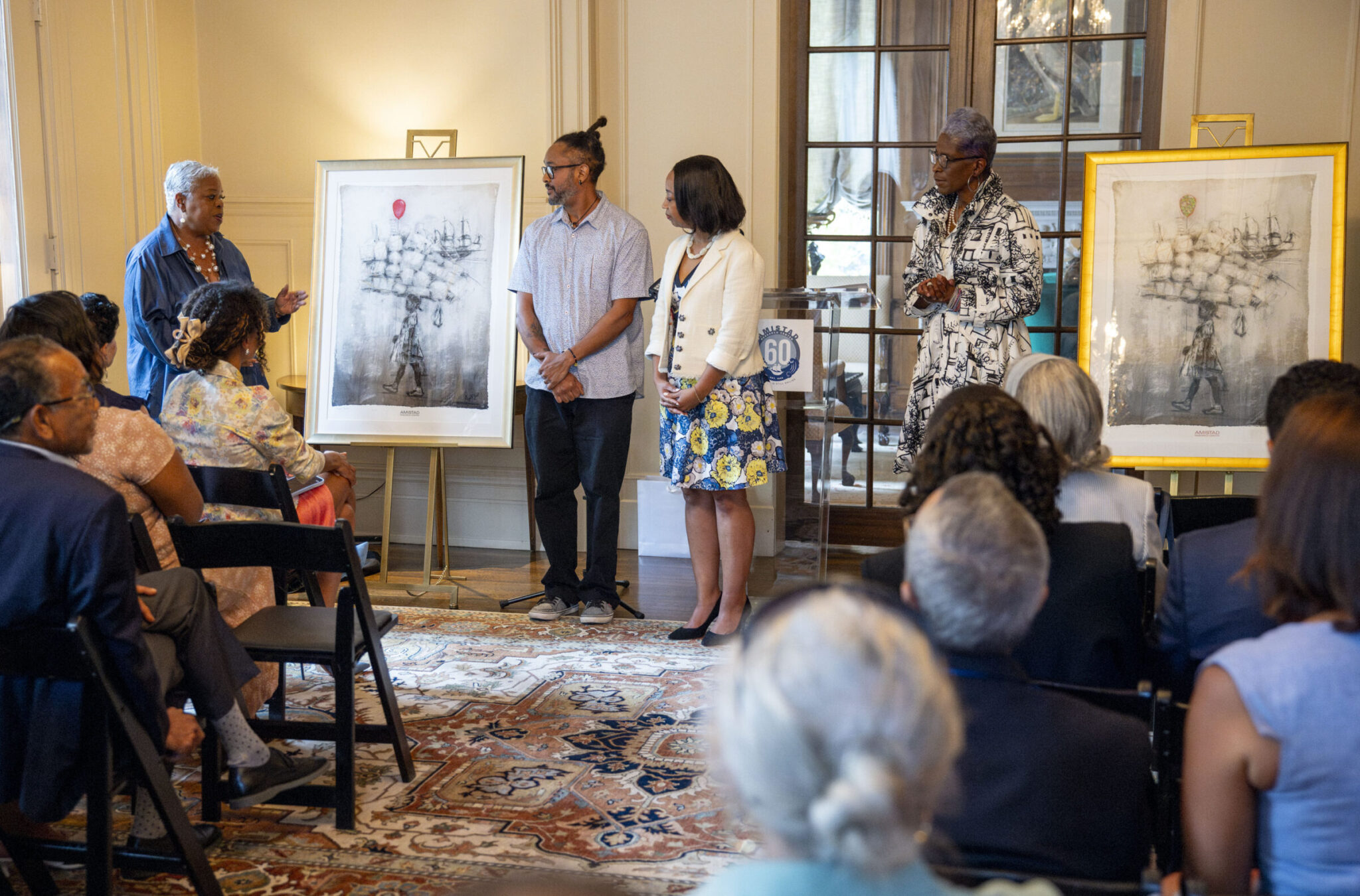 Amistad Research Center leadership and supporters celebrate the organization's 60th anniversary during a press conference at Tulane University.