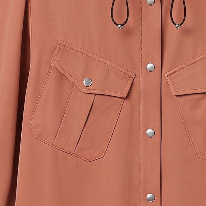 Flat detail of the chest pocket and snaps