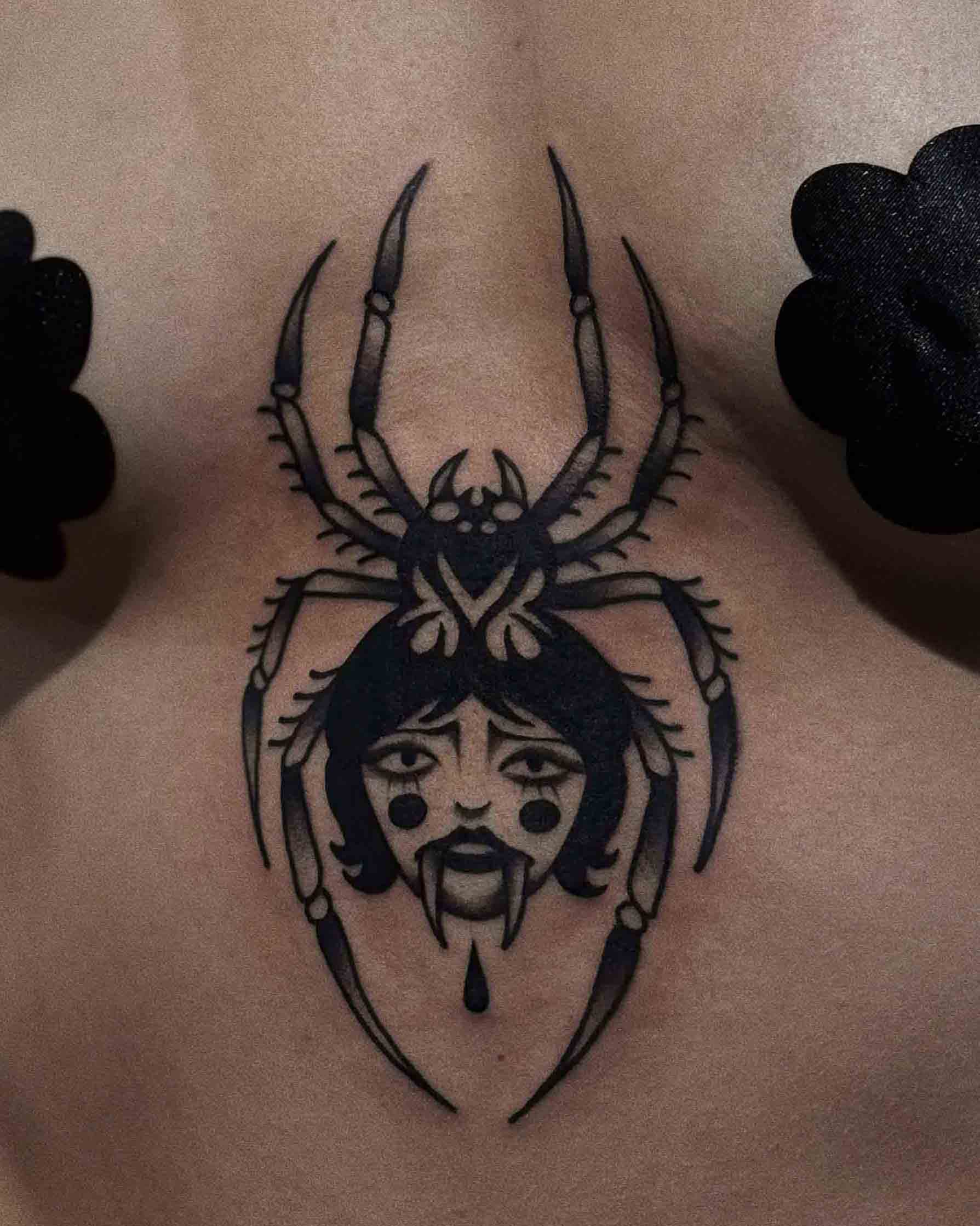 Spder tattoo on chest