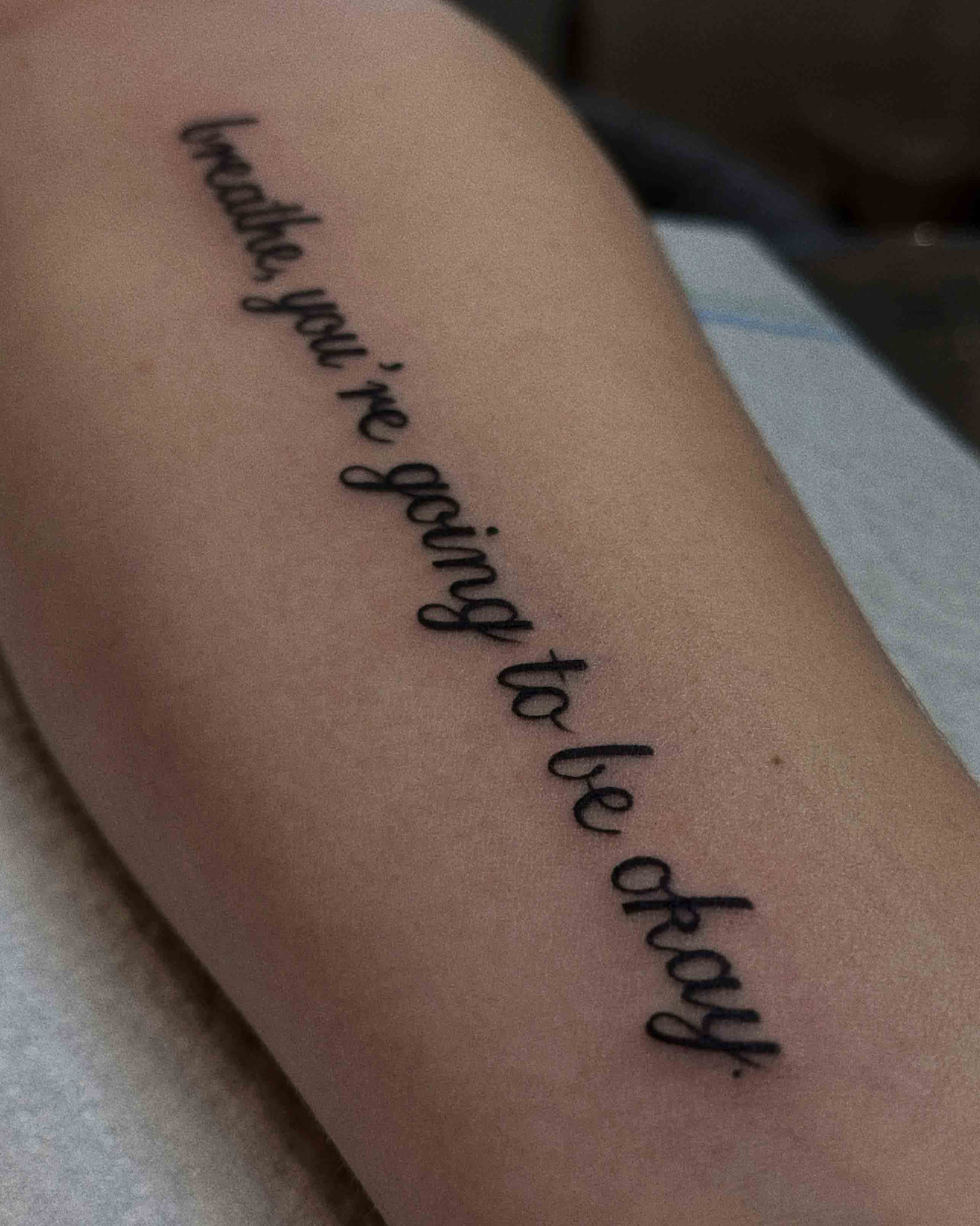 Text tattoo on forearm