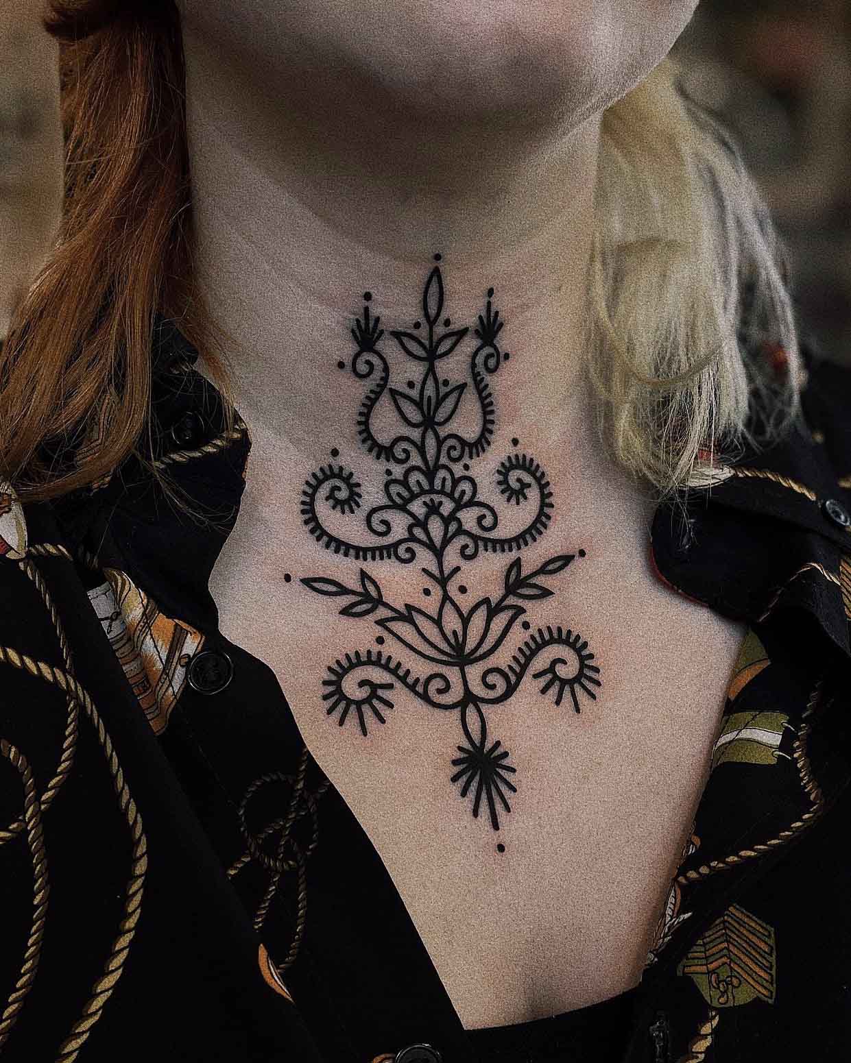 Ornamental tattoo on neck