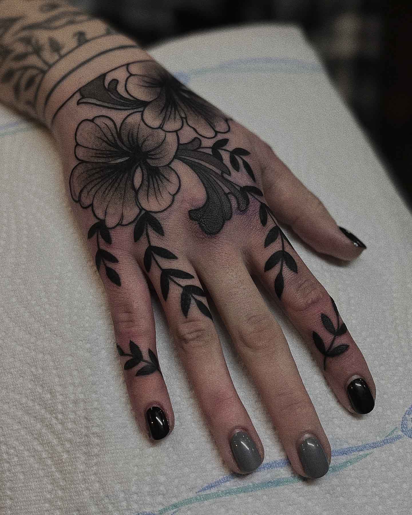 Floral palm tattoo