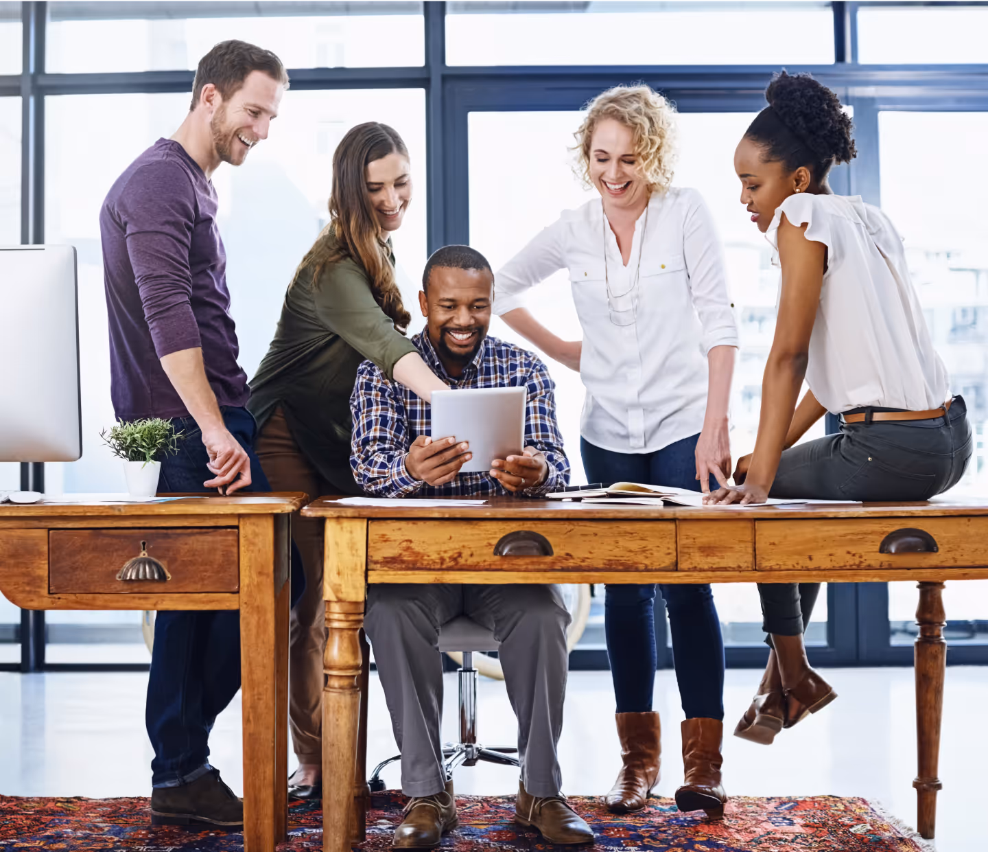 Team collaborating around a desk