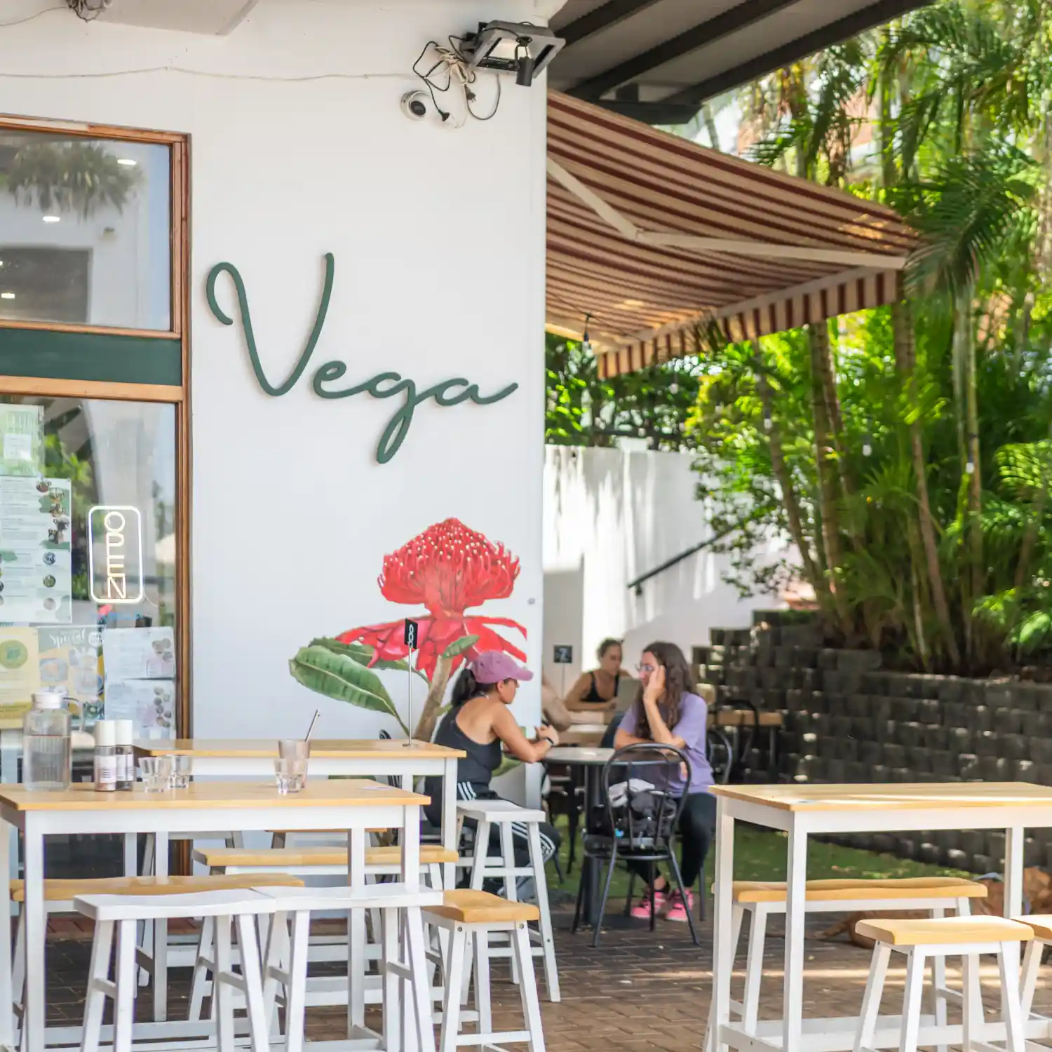 vega cafe storefront with customers