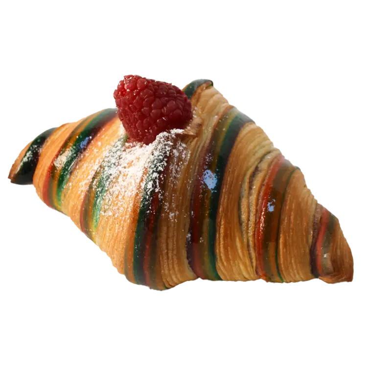 Croissant carnaval multicolore bien doré avec une framboise sur le dessus